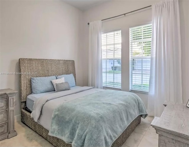 bedroom with light tile patterned flooring