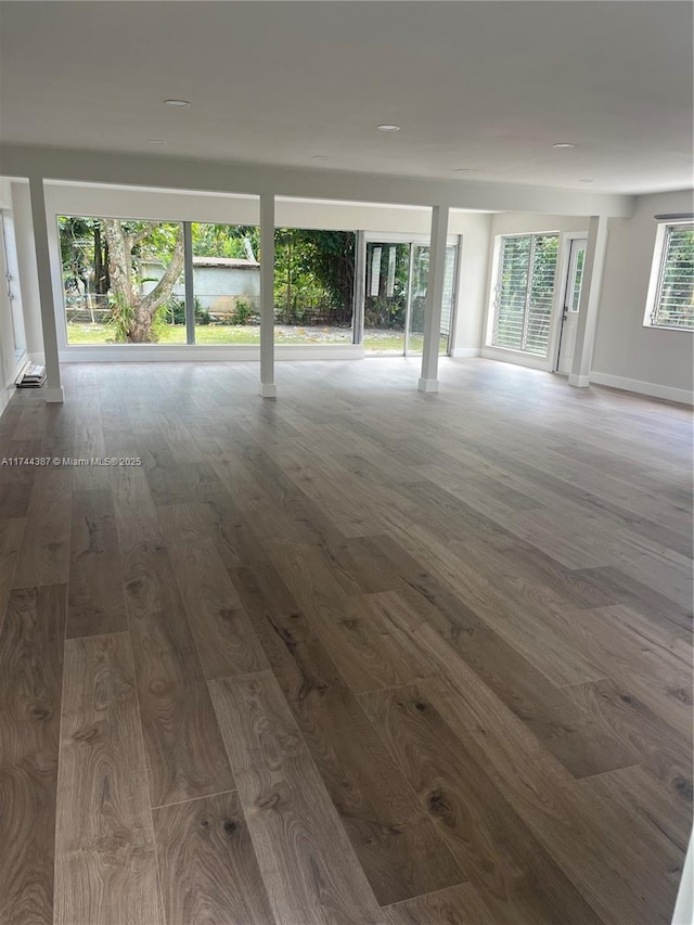 empty room featuring dark wood-type flooring