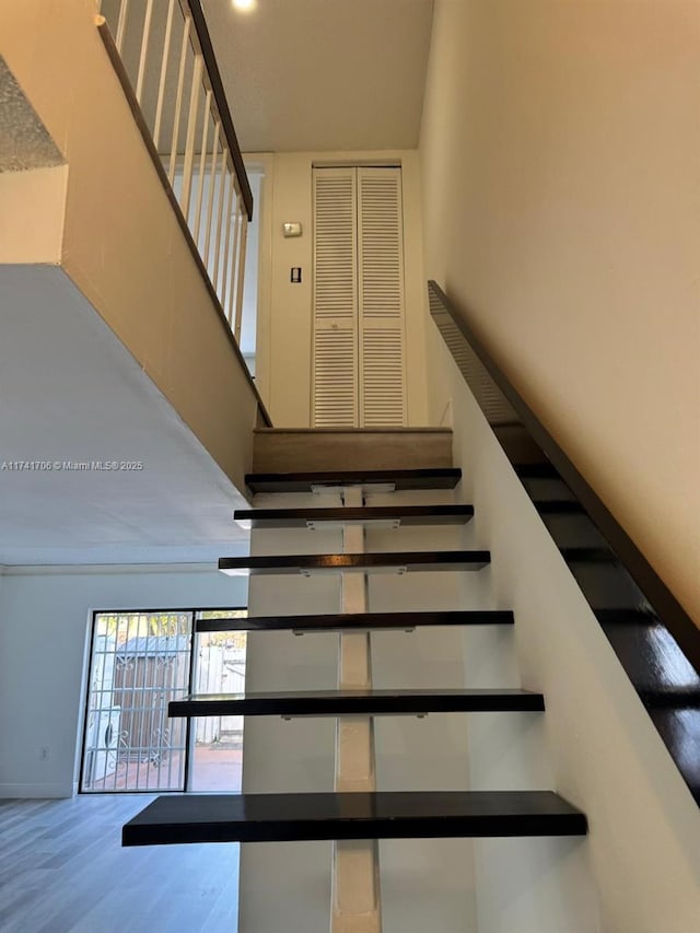 10800 NW 7th St Unit 3B, Miami, FL 33172 - stairs featuring a towering ceiling and wood finished floors