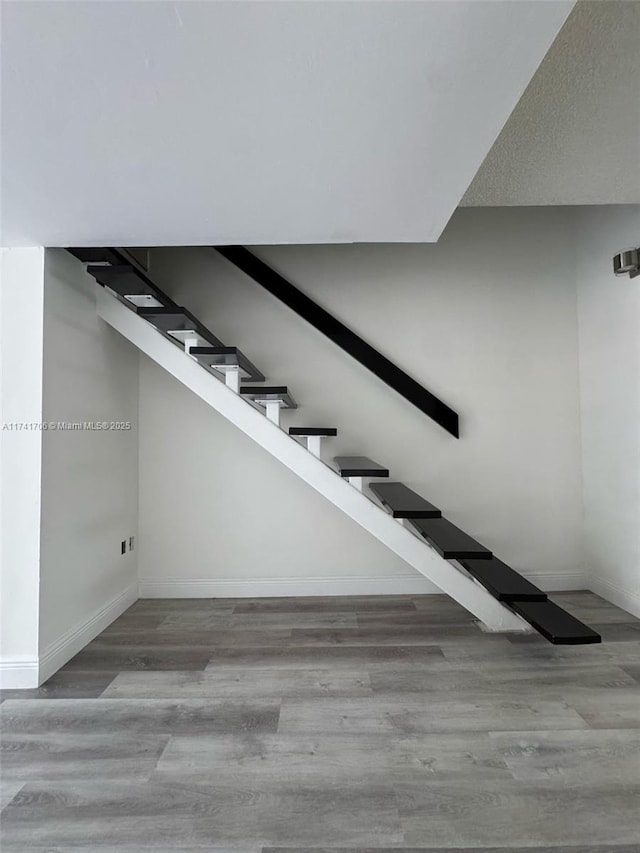 10800 NW 7th St Unit 3B, Miami, FL 33172 - stairs featuring wood finished floors and baseboards