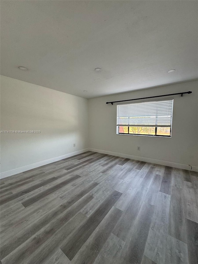 10800 NW 7th St Unit 3B, Miami, FL 33172 - empty room with baseboards and wood finished floors