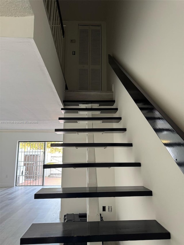 10800 NW 7th St Unit 3B, Miami, FL 33172 - staircase featuring wood finished floors