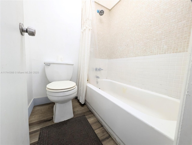 bathroom with shower / bath combination with curtain, toilet, and hardwood / wood-style floors