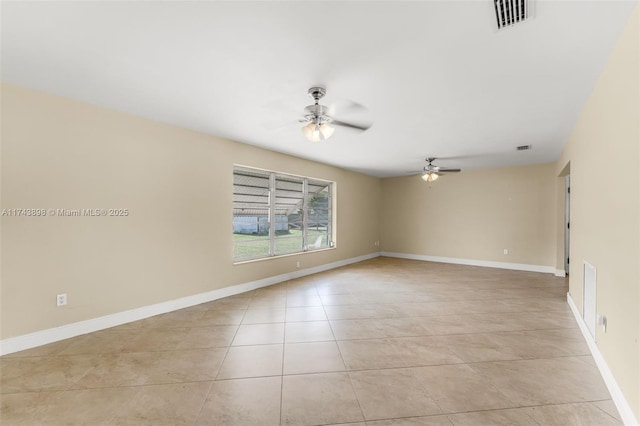 spare room featuring light tile patterned flooring and ceiling fan