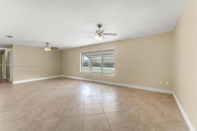 spare room with light tile patterned flooring and ceiling fan