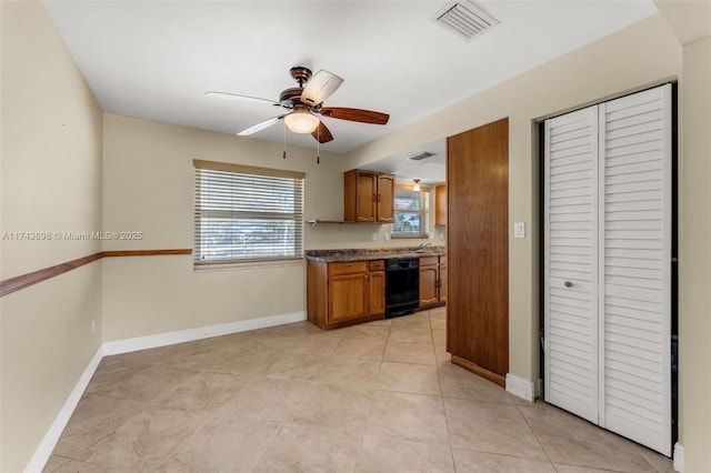 kitchen featuring ceiling fan, dishwasher, and light tile patterned floors