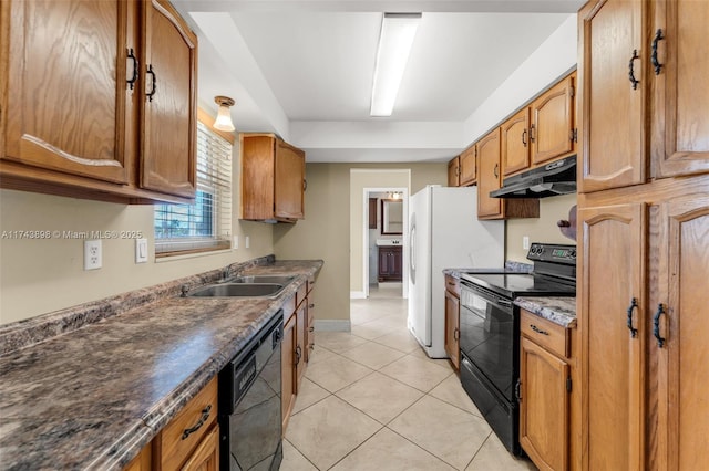 kitchen with sink, light tile patterned floors, and black appliances