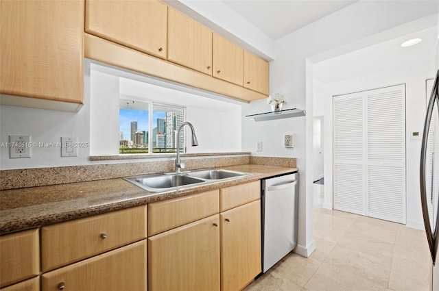 kitchen with light brown cabinets, dishwasher, a sink, and light tile patterned floors