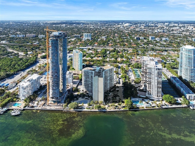 birds eye view of property with a view of city and a water view