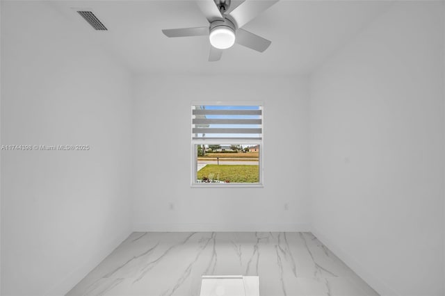 spare room with ceiling fan