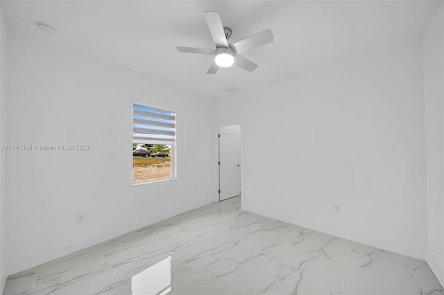 spare room with ceiling fan