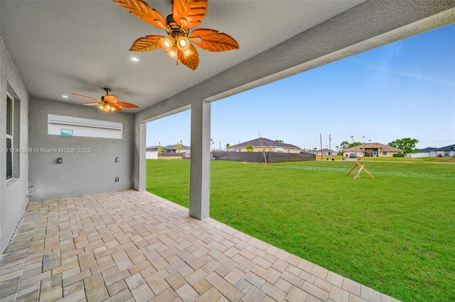 view of patio / terrace featuring ceiling fan