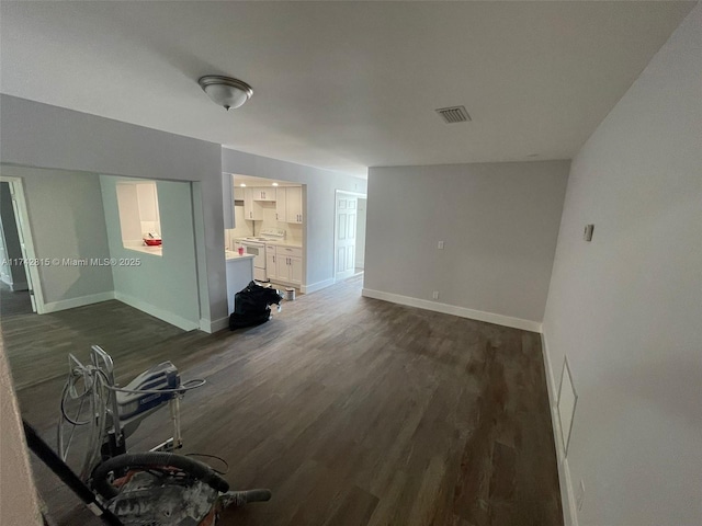 unfurnished living room with dark hardwood / wood-style flooring