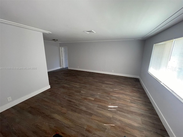 spare room with dark wood-type flooring