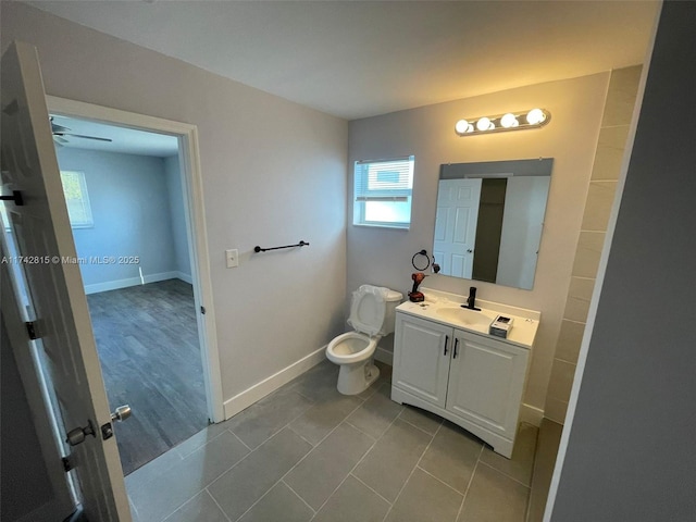 bathroom with vanity, toilet, and tile patterned flooring