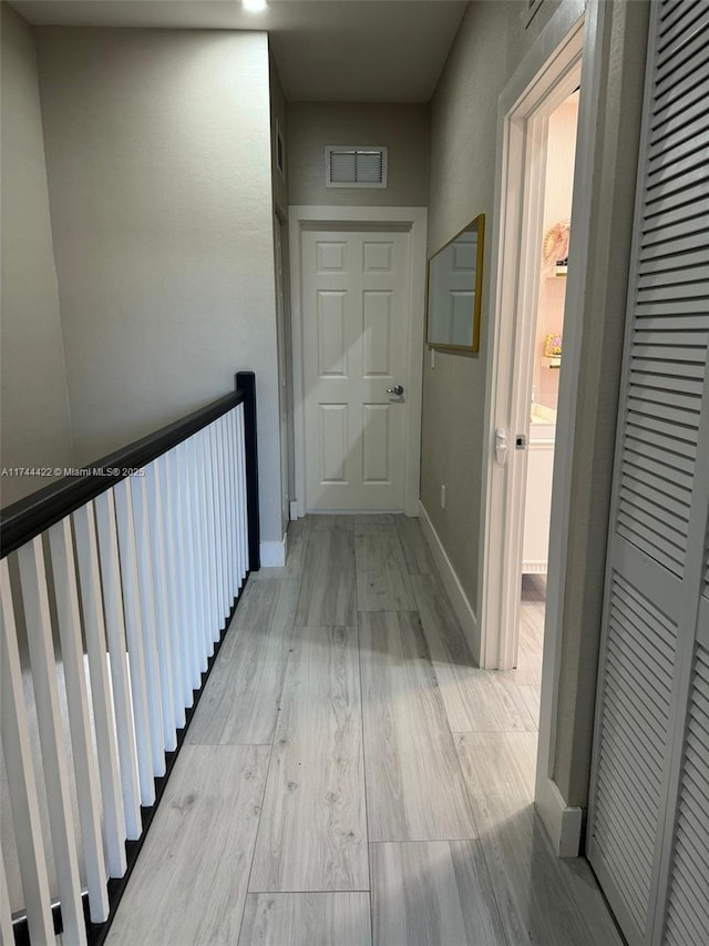 hallway featuring light wood-type flooring