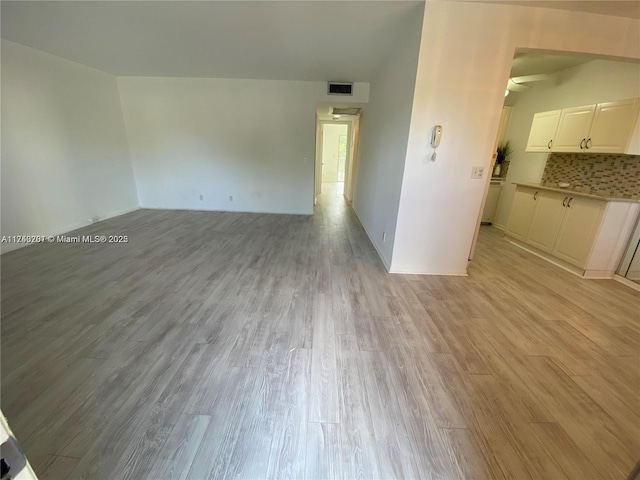 unfurnished room featuring light hardwood / wood-style flooring