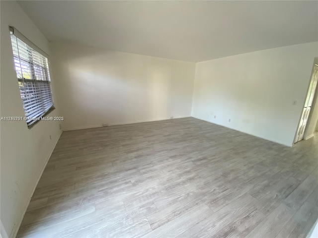 empty room with light hardwood / wood-style floors