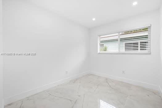 1431-1433 N 14th Way, Hollywood, FL 33020 - unfurnished room featuring marble look tiles and recessed lighting