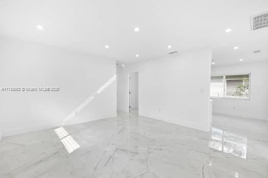 1431-1433 N 14th Way, Hollywood, FL 33020 - unfurnished room featuring marble tiled floors and recessed lighting