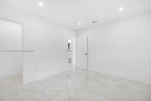 1431-1433 N 14th Way, Hollywood, FL 33020 - spare room with marble finish flooring and recessed lighting