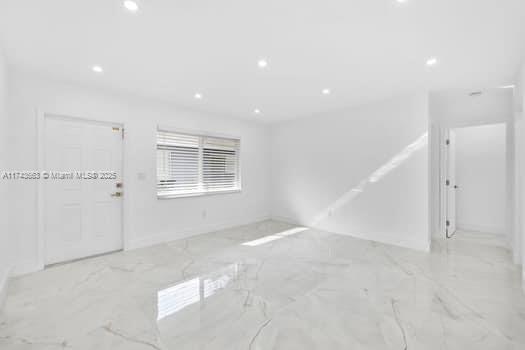 1431-1433 N 14th Way, Hollywood, FL 33020 - unfurnished room featuring recessed lighting and marble tiled flooring