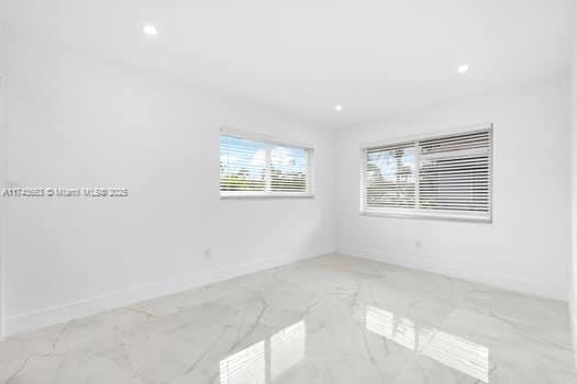 1431-1433 N 14th Way, Hollywood, FL 33020 - unfurnished room featuring marble finish floors and recessed lighting