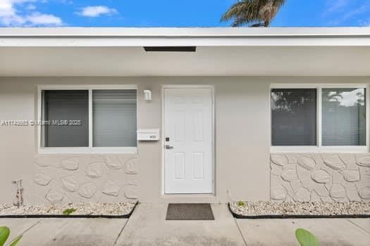 1431-1433 N 14th Way, Hollywood, FL 33020 - view of exterior entry with stucco siding