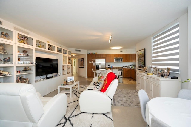 living area featuring visible vents