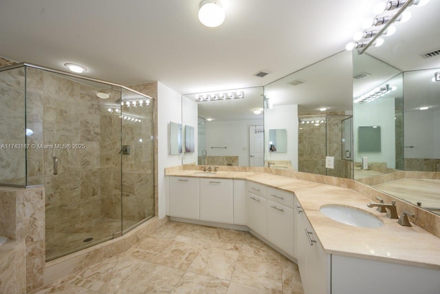 bathroom with vanity and an enclosed shower