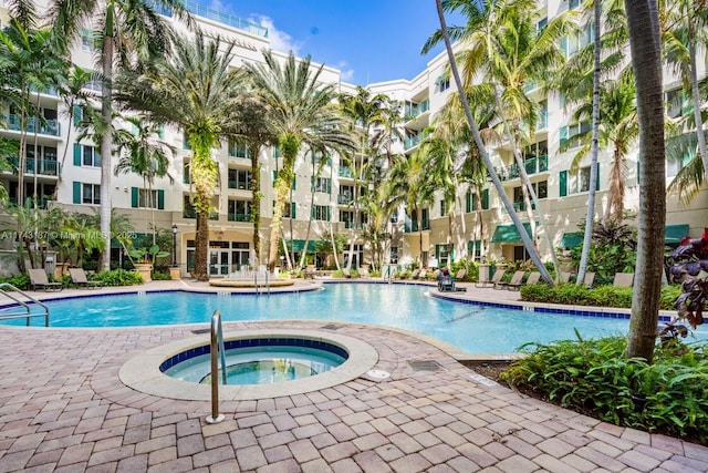 view of pool with a community hot tub