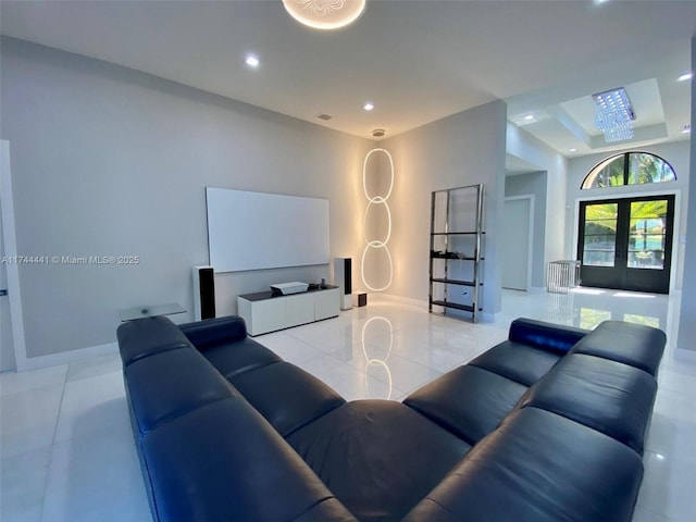 living area with recessed lighting, french doors, visible vents, and baseboards