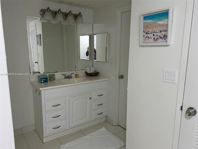 bathroom featuring tile patterned flooring and vanity