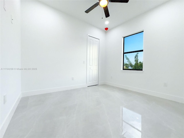 unfurnished room with ceiling fan