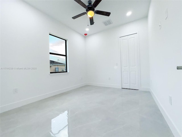 unfurnished room with ceiling fan