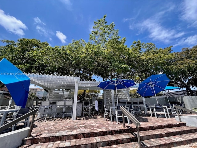 1470 NE 123rd St Unit A707, North Miami, FL 33161 - dock area featuring outdoor dining space, fence, a pergola, a patio area, and outdoor dry bar