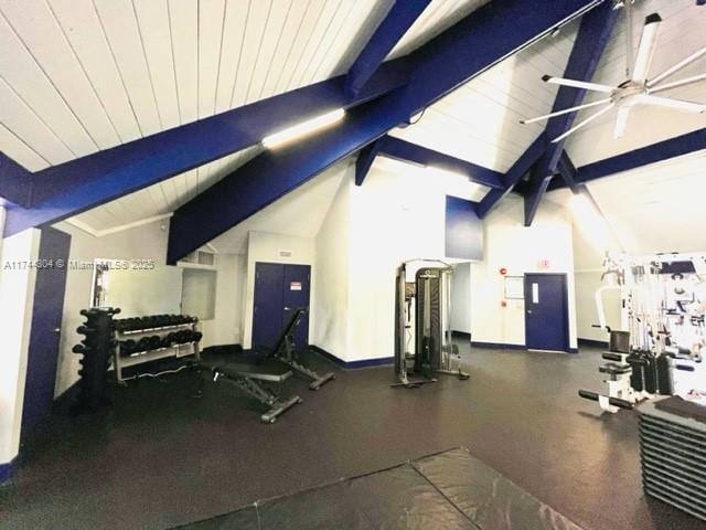 exercise room featuring lofted ceiling and wooden ceiling