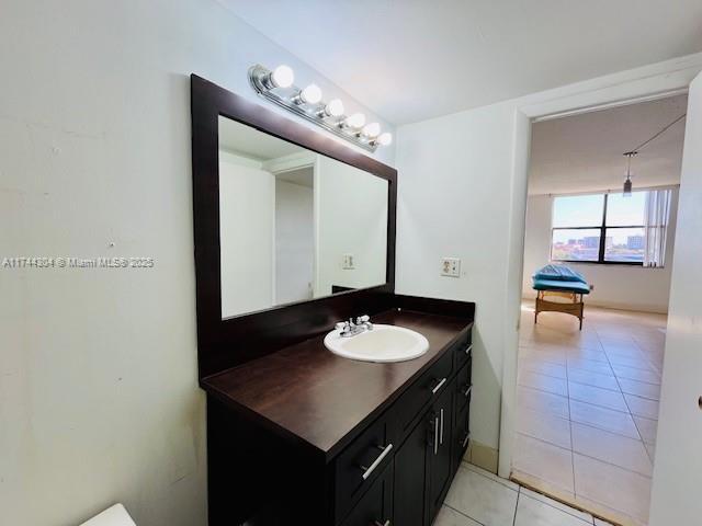 1470 NE 123rd St Unit A707, North Miami, FL 33161 - bedroom with light tile patterned flooring, baseboards, and a textured ceiling