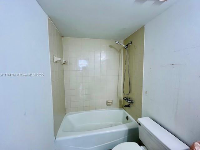 1470 NE 123rd St Unit A707, North Miami, FL 33161 - hall with light tile patterned floors, baseboards, and a textured ceiling