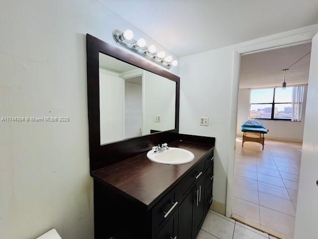 bathroom with tile patterned floors and vanity