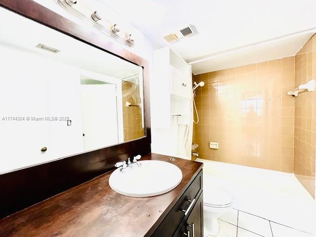 1470 NE 123rd St Unit A707, North Miami, FL 33161 - corridor with baseboards, a paneled ceiling, ornamental molding, and light tile patterned flooring