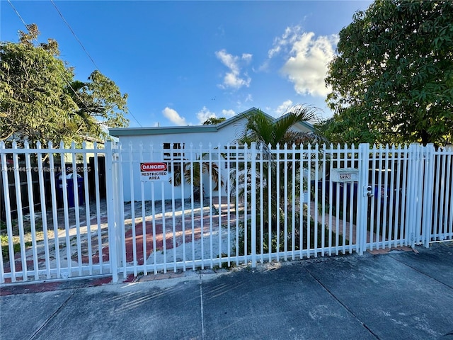 view of gate featuring fence