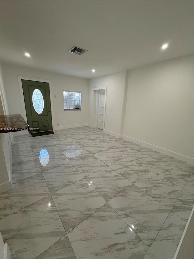 entrance foyer featuring recessed lighting, visible vents, and baseboards