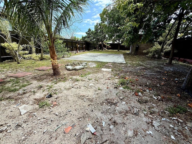 view of yard with a fenced backyard and a patio