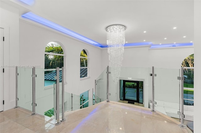 unfurnished living room with a chandelier