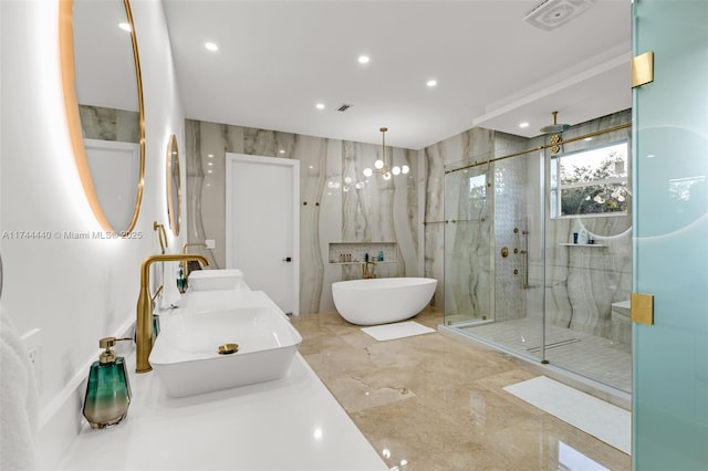 bathroom featuring tile walls, vanity, and plus walk in shower