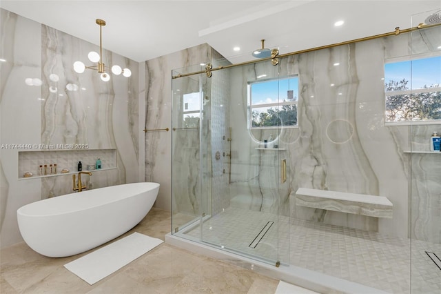 bathroom with separate shower and tub, plenty of natural light, and tile walls