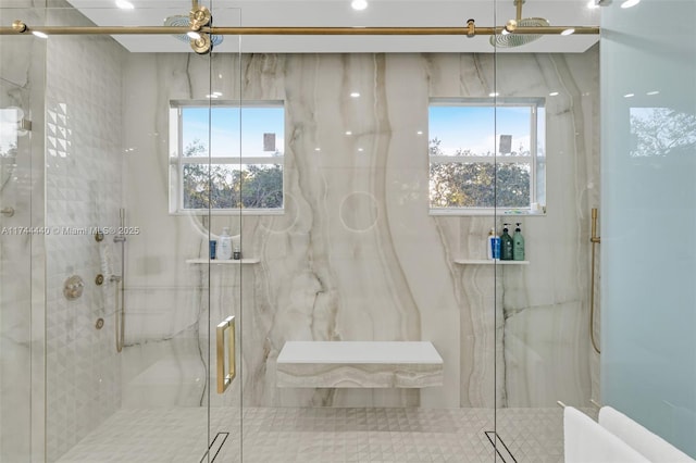 bathroom with walk in shower and a wealth of natural light