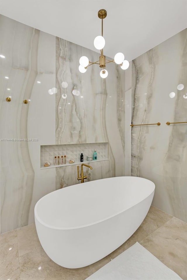 bathroom featuring tile walls, sink, and a bathtub