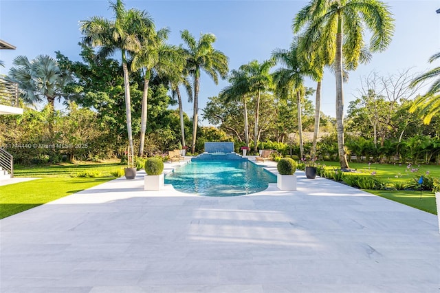 view of pool featuring a patio and a lawn